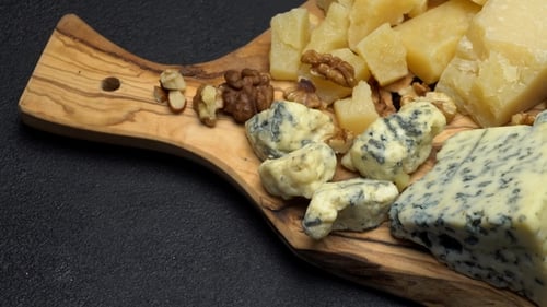 Various Types of Cheese - Brie, Camembert, Roquefort and Cheddar