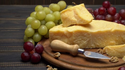 Cheese and Grapes on Wooden Serving Board