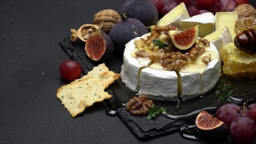 Cheese Board with Figs, Grapes, Walnuts, and Honey
