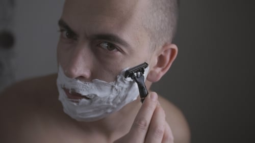Man Shaving with Foam and Manual Razor