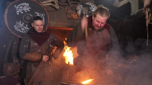 Men Working as Blacksmiths in Medieval Shop
