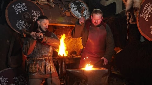 Blacksmiths Forge Metal in Dark Workshop