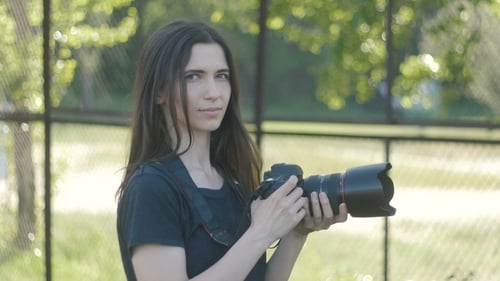 Portrait of Photographer Woman Taking Photos in Park