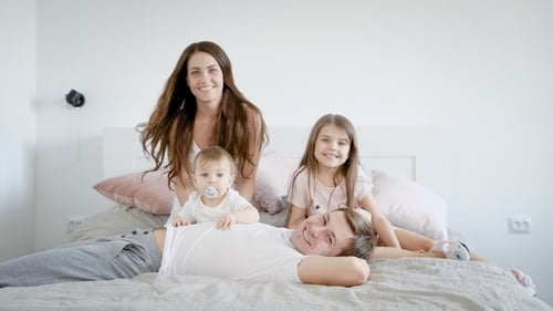 Parents with Kids Spending Time in Bed