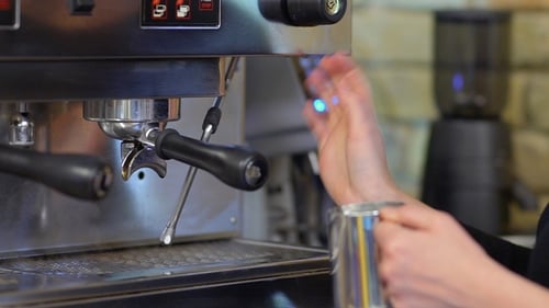 Barista Steaming Milk for Coffee Drink Close Up