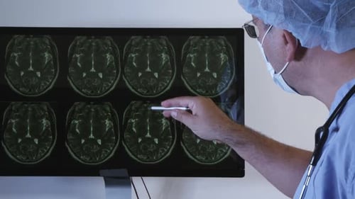 Doctor Analyzing X-ray Charts On The Computer 05