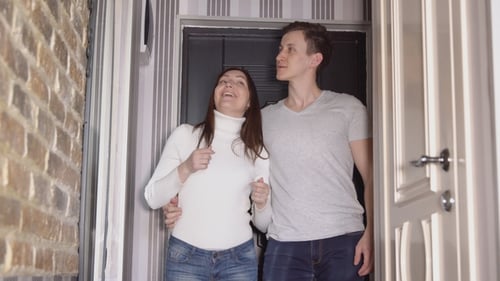 Couple Arriving at Home with Apartment Keys