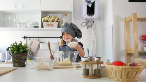 Happy Little Girl Baker Going To Bake Cookies in the Kitchen