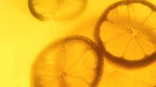 Macro Shot of Lemon Slices in Yellow Liquid