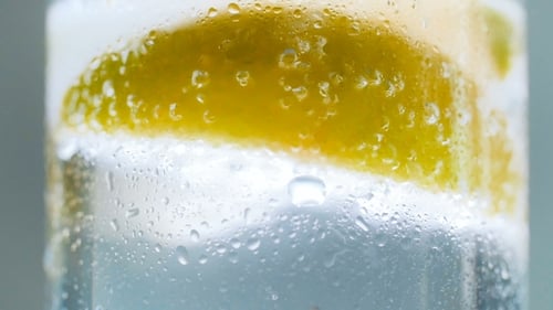 Refreshing Drink with Lemon Slice and Ice Cubes