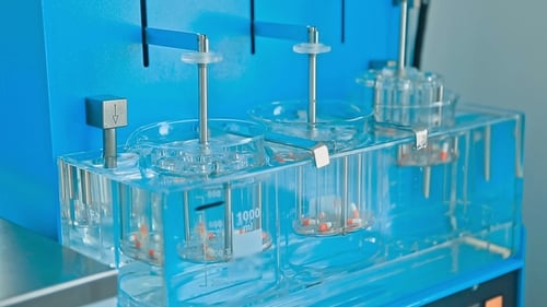 Drug Capsules Stirring in Scientific Apparatus