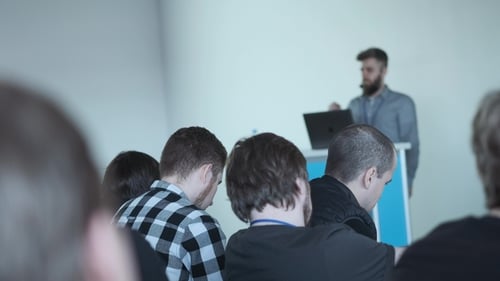 Man Giving Presentation at a Corporate Event