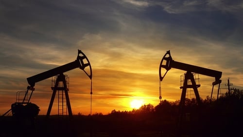 Oil Pumpjacks Silhouetted at Colorful Sunrise