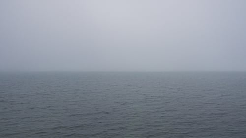 Morning Calm Water Surface with Fog