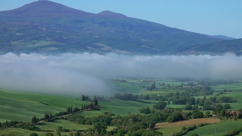Fog Over Farmland Hill Country in Tuscany, Italy