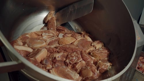 Production Line at the Meat-packing Plant. Fresh Pieces of Pork and Beef Meat Are Processed