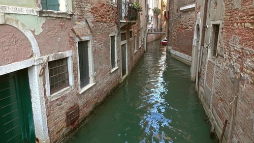 Old Houses and Narrow Canal in Venice, Italy,