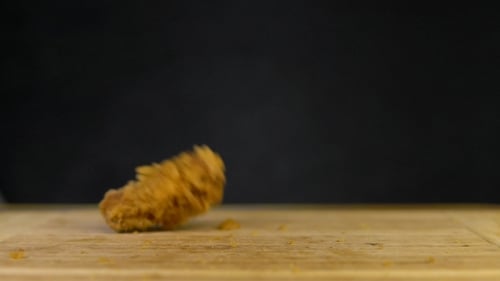 Crispy Fried Chicken Pieces Falling in Slow Motion
