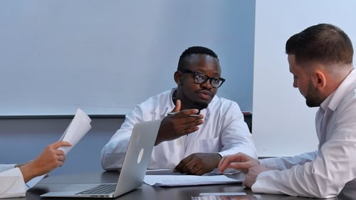 Multiracial Group of Doctors Having Discussion in Office