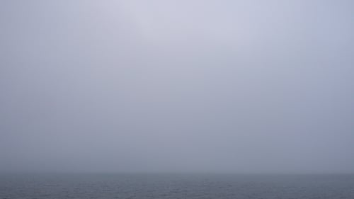 Foggy Ocean with Calm Water