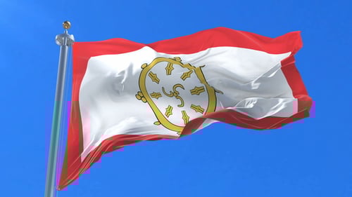 Buddhist Dharma Wheel Flag Waving in Blue Sky