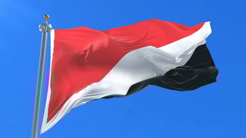 Realistic Red White Black Flag Waving Loop against Blue Sky