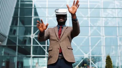 Professional Man Using VR Headset Outside Office Building