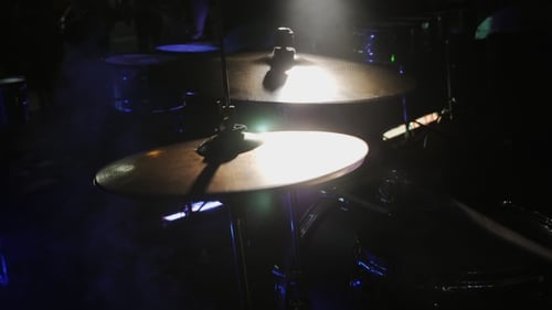 Drummer Hand Playing Drum Plate on Rock Concert