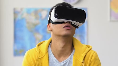 Young Adult Using Virtual Reality Headset at Home