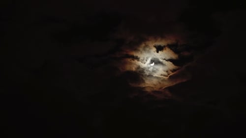 Dramatic Moon with Clouds in the Night Sky