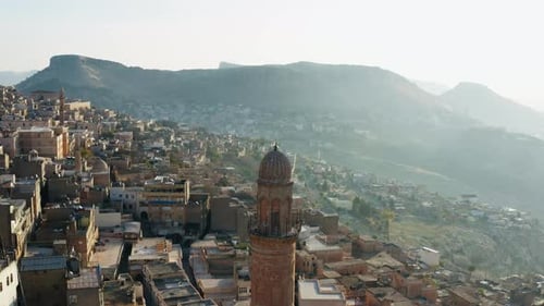 Drone Video of the Minaret of the Mosque in the Old Town at Sunrise