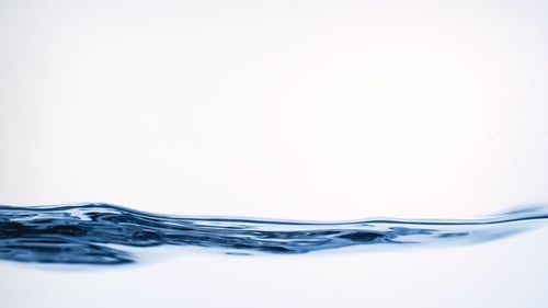 Clean Water Surface and Splash. Liquid Splashing on White Background in