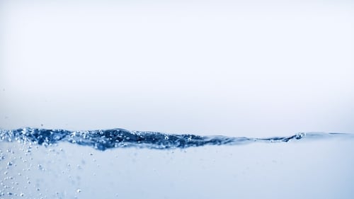 Water Boiling and Splash with Lot of Air Bubbles. Pouring Liquid Isolated on White Background