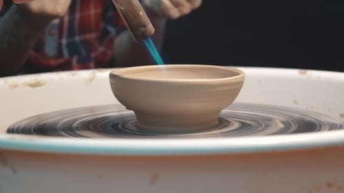 Clay Bowl on Pottery Wheel With Flame