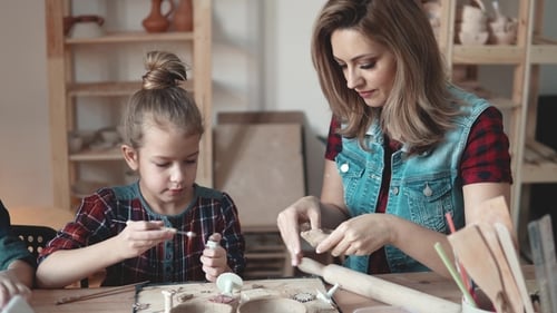 Mother and Daughter Working with Clay at Home