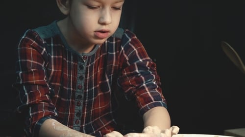 Child Learning Pottery from Adult at Wheel