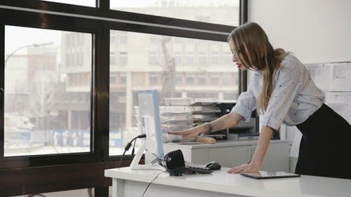 Business Coworker Monitoring and Working with the Pc in Office