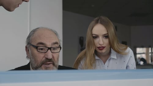 Team Looks at Computer Display in Office