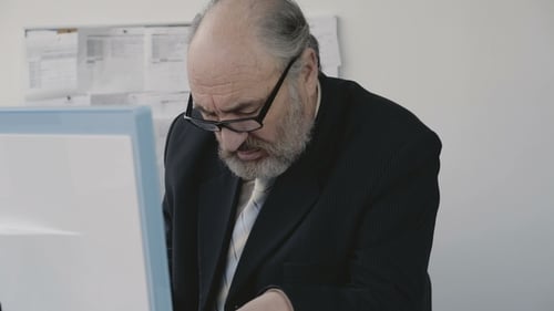 Excited Businessman Working at a Computer