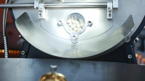 Close Up of Coffee Beans Roasting in Machine