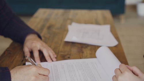 Man Signs Documents and Receives Keys
