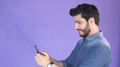 Man Texts Message on Phone