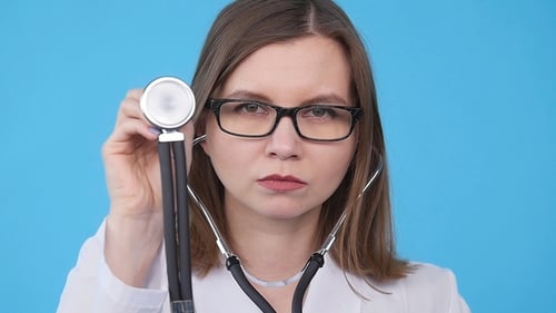 Doctor Examines with Stethoscope in Close Up