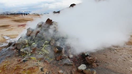 Eruption of Geyser in Iceland. Red Soil, Like the Surface of the Planet Mars