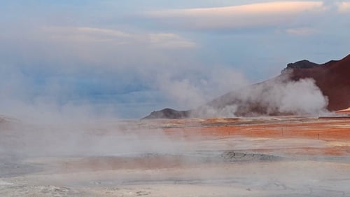 Eruption of Geyser in Iceland. Red Soil, Like the Surface of the Planet Mars