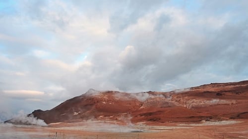 Eruption of Geyser in Iceland. Red Soil, Like the Surface of the Planet Mars