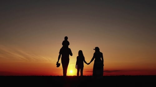 Silhouette at Sunset Happy Family Walking