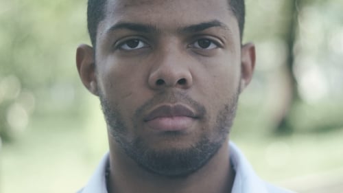 Portrait of Man with Short Hair Looking at Camera