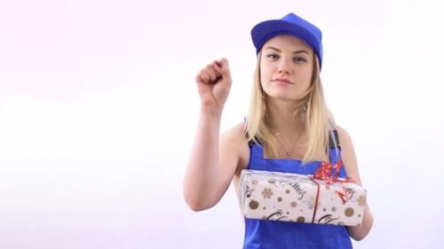 Young Woman Delivers a Wrapped Holiday Gift