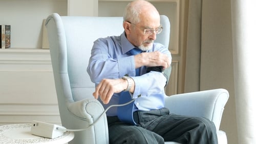 Senior Man Taking Blood Pressure at Home